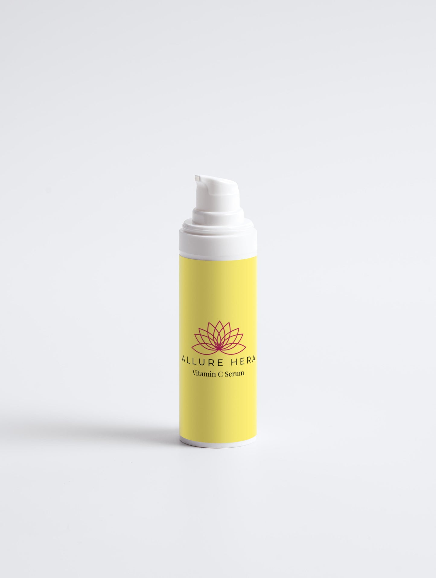 Yellow serum bottle with white cap on a light gray background