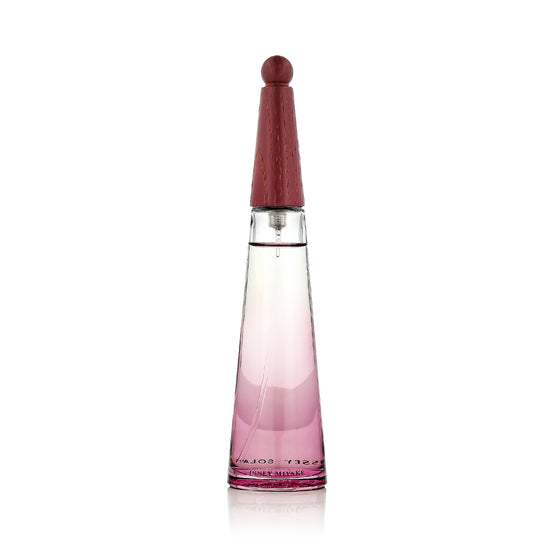 Perfume bottle with pink gradient design on a white background