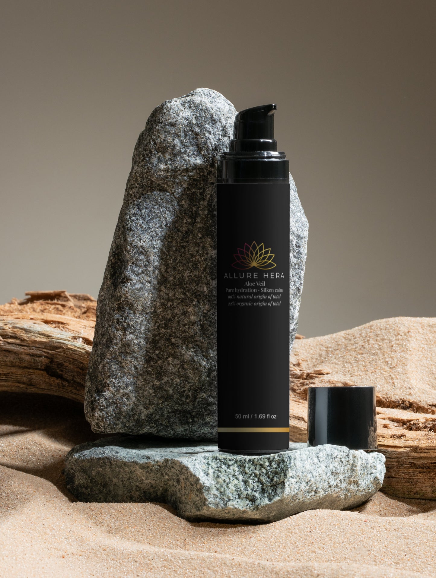 Black skincare product with brand logo on a rock and wooden background