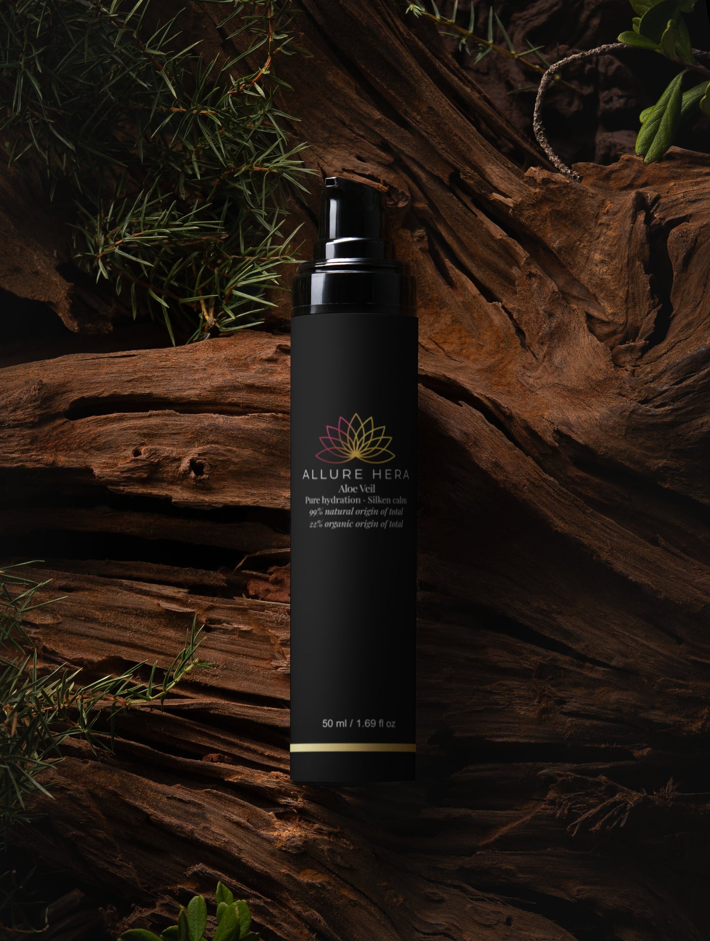 Black spray bottle with Allure Hera logo on a wooden surface with greenery