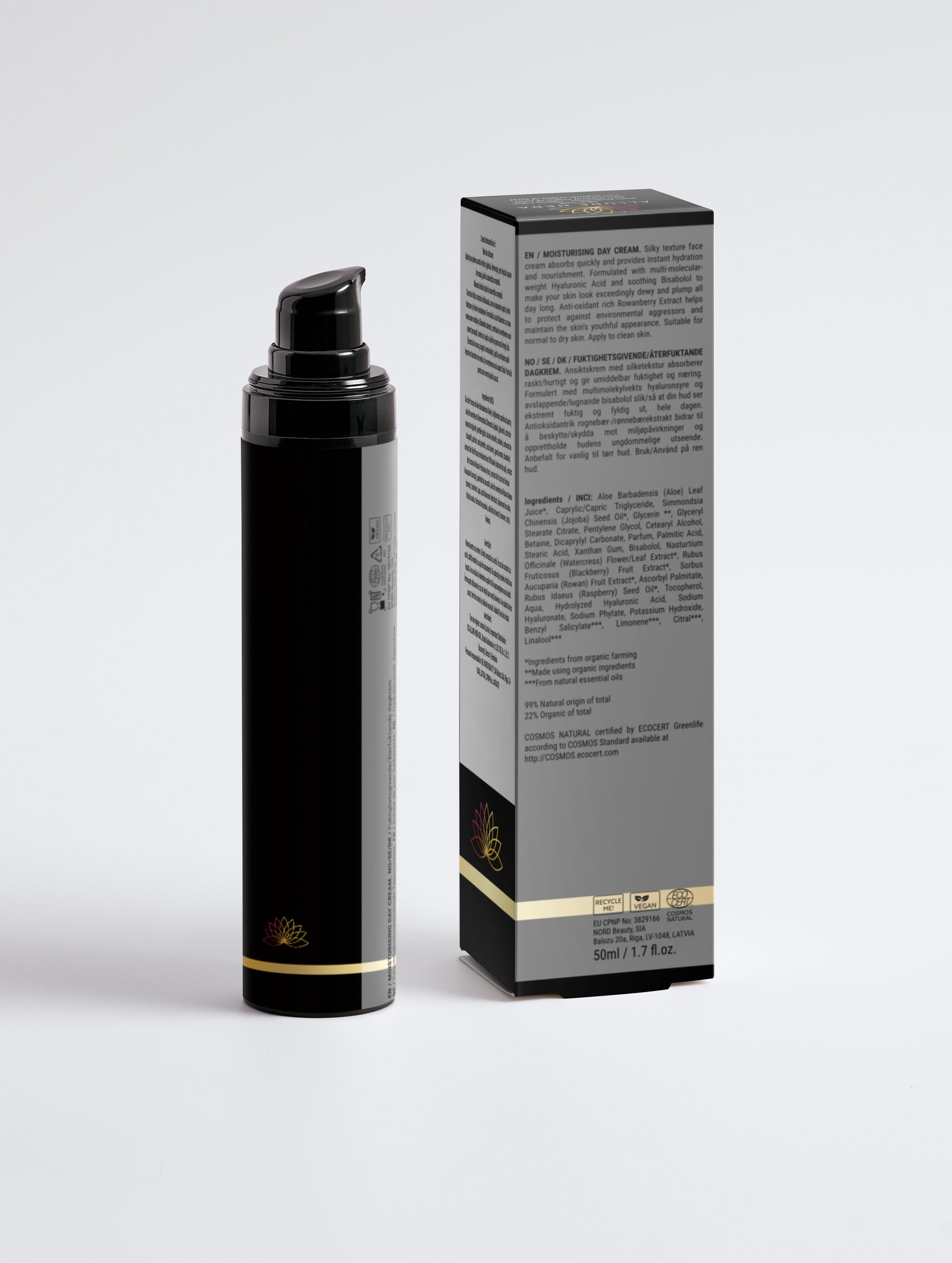 Black cosmetic bottle with gold accents next to its packaging on a light gray background