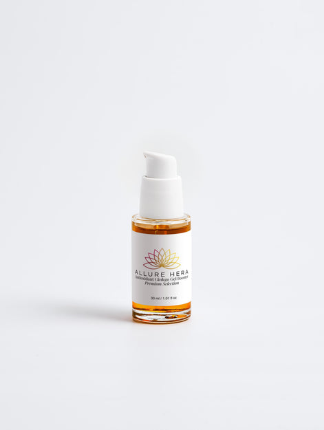 Skincare serum bottle with white cap and label on a light gray background