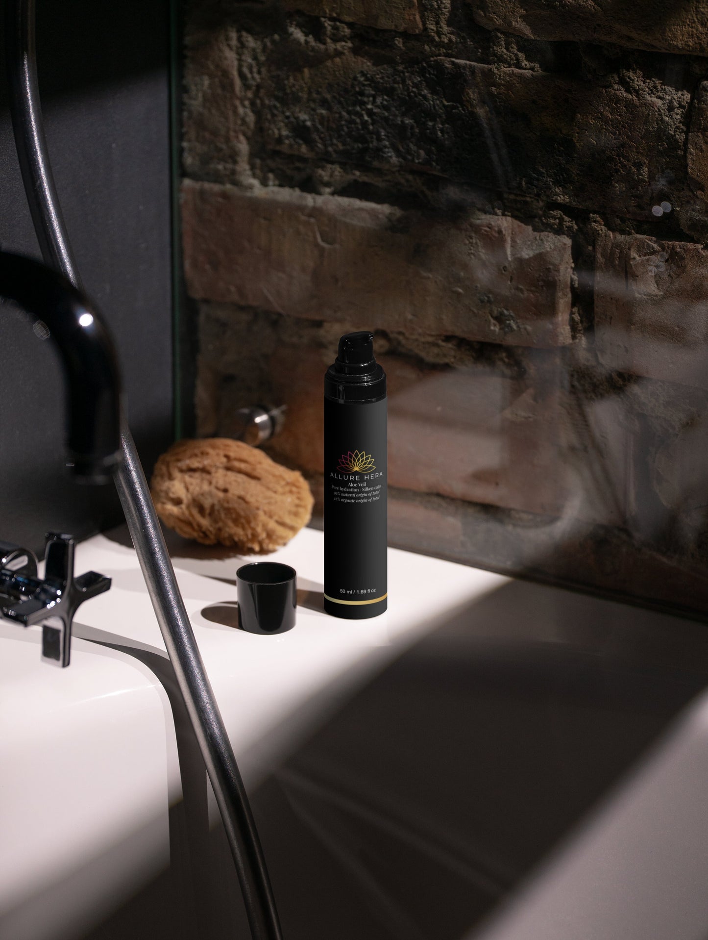 Black bottle of Caudalie on a bathroom counter with stone wall background